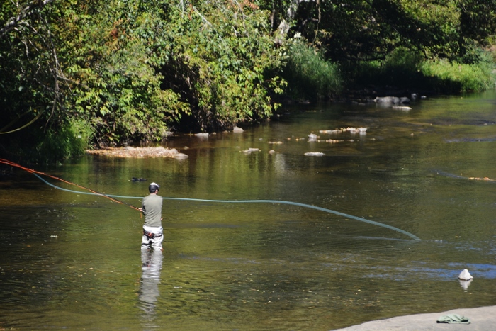 anglers fishing in creek